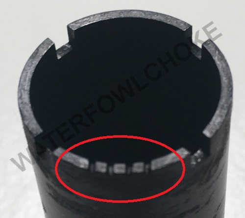 a choke tube with 4 lines or notches indicating the choke size is improved cylinder