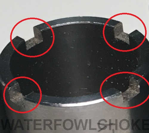 4 grooves on a choke tube where the choke wrench sits to create torque for removal and installation